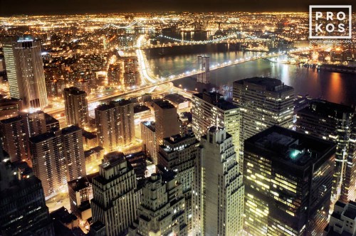 An aerial view of Lower Manhattan and the Brooklyn Bridge at night, New York City
