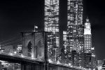 A night view of the Brooklyn Bridge and skyscrapers of Lower Manhattan in black and white, including World Trade Center and New York by Gehry