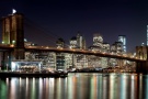 An ultra high-definition panoramic photo of the Brooklyn Bridge and Lower Manhattan skyline at night, New York City. Large-scale prints of this photo are available up to 150 inches wide.