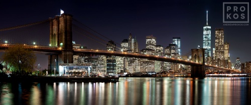 An ultra high-definition panoramic photo of the Brooklyn Bridge and Lower Manhattan skyline at night, New York City. Large-scale prints of this photo are available up to 150 inches wide.