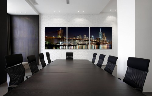A framed panoramic triptych of the Brooklyn Bridge at Night