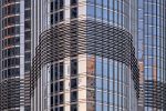 A close-up architectural detail from the facade of the Burj Khalifa tower in Dubai, UAE