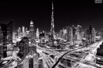 A black and white photo of the Burj Khalifa and skyline of Downtown Dubai at night, United Arab Emirates. High-definition fine art prints of this photo are available up to 90 inches in width and framed in wood, metal and acrylic styles. 