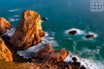 A landscape photo of the Atlantic Ocean from Cabo da Roca, the Western-most point in Portugal and Europe, at dusk. Fine art prints of this photo are available framed in various styles.