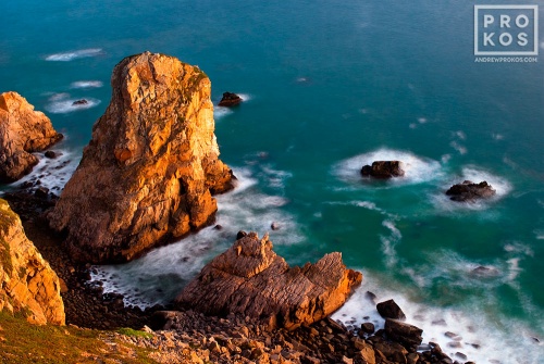 A landscape photo of the Atlantic Ocean from Cabo da Roca, the Western-most point in Portugal and Europe, at dusk. Fine art prints of this photo are available framed in various styles.
