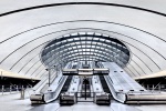 A panoramic view of the contemporary architectural interior of Canary Wharf Underground Station in London, United Kingdom. Limited-edition fine art prints of this photo are available up to 120 inches in width and framed in various wood, metal, and acrylic styles.