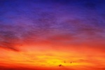A large-format panoramic landscape photo of the sky over Cape Cod at sunset