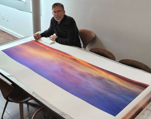 Photographer Andrew Prokos Signing a 72" Limited Edition Print of 'Cape Cod Skyscape'