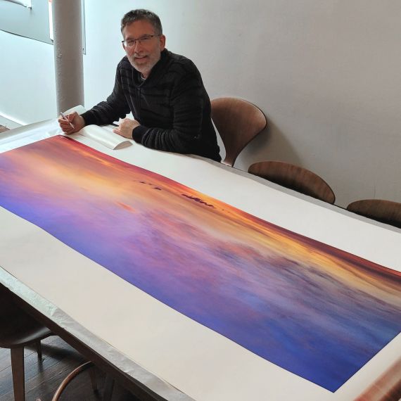Photographer Andrew Prokos Signing a 72" Limited Edition Print of 'Cape Cod Skyscape'