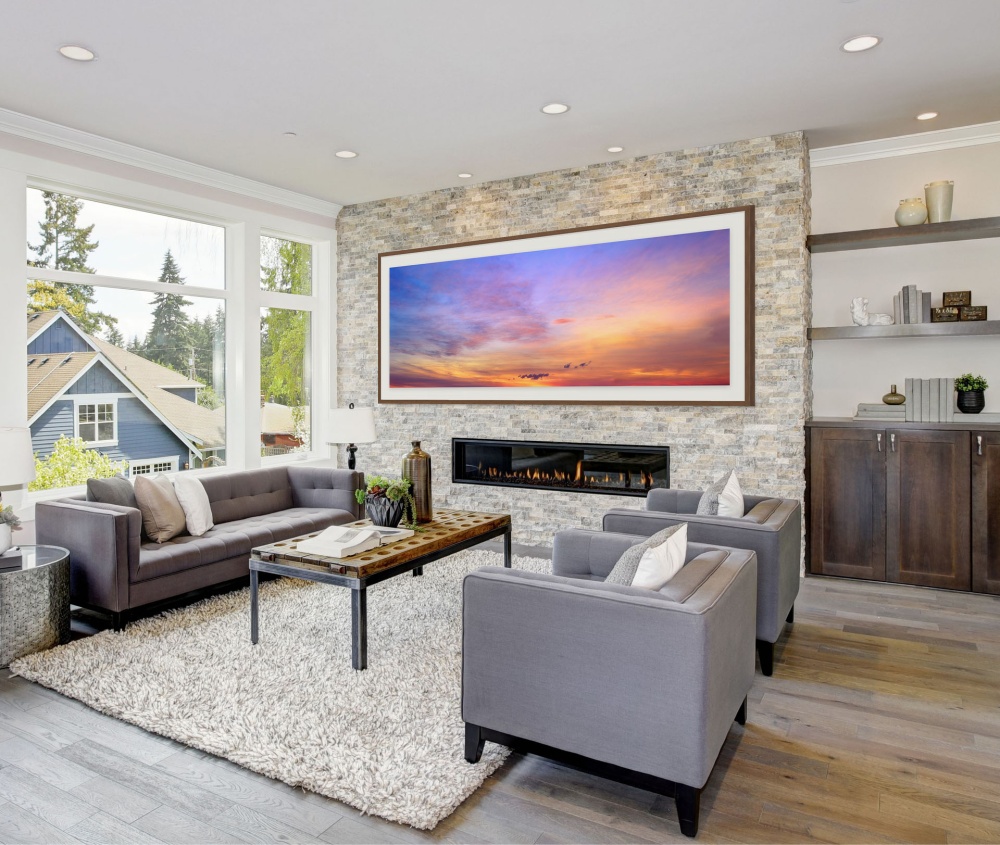 A large-format framed skyscape photograph of Cape Cod, MA by photographer Andrew Prokos seen in a luxury home