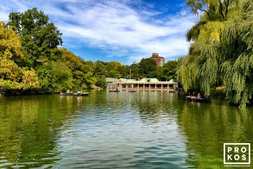 A landscape photo of the lake and boathouse in Central Park in Summer, New York City