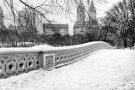 A black and white panoramic landscape photo of Central Park's Bow Bridge in Winter, New York City. Large-format fine art prints of this photo are available up to 120" wide and framed in various wood, metal, and acrylic styles. 