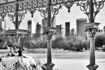 A black and white view of the frozen lake and Midtown skyline from the cast-iron gazebo in Central Park in Winter. Fine art prints of this photo are available for purchase framed in various styles.