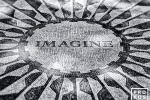A black and white photo of the Imagine mosaic in Central Park's Strawberry Fields, dedicated to the memory of John Lennon. New York City