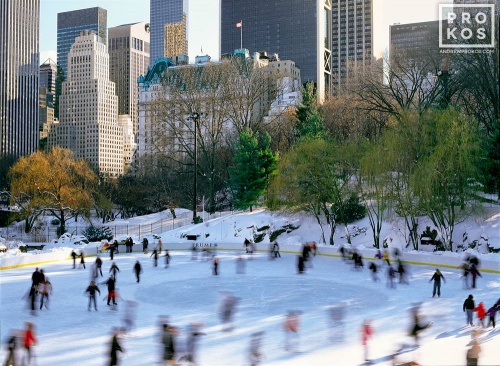 A color landscape photo of the ice skaters at Wollman Rink in motion, Central Park, New York City. Framed fine art prints of this photo are available up to 60 inches in width. 