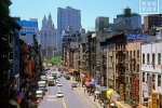 A color street scene photo of East Broadway in Chinatown, New York City. Framed fine art prints of this photo are available up to 50 inches in width. 
