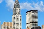 A color photo of the Chrysler Building, Met Life Building and Midtown Manhattan skyline during the day, New York City