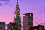 A view of the Chrysler Building and met Life Building set against a vivid sky at twilight, New York City