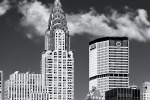 A black and white photograph of the Chrysler Building, Met Life Building and Midtown Manhattan skyline during the day, New York City. Fine art prints of this photo are available framed in various wood, metal and acrylic styles.