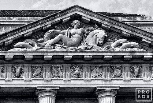 An architectural detail from the neoclassical pediment from the US Department of Commerce building in black and white, Washington DC. Fine art prints of this photo are available framed in various styles. 
