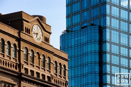 The facade of Cooper Union set against a the backdrop of a modern high-rise building in the East Village, Manhattan, New York City