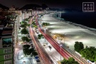 A high-definition long-exposure photograph of Rio de Janeiro's Copacabana beach at night