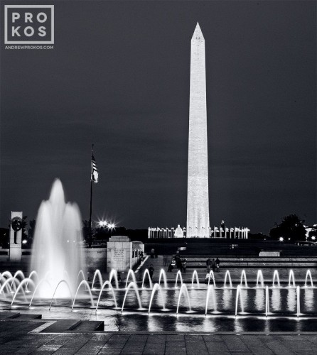 A black and white long-exposure photo of the Washington Monument from the World War II Memorial at Night, Washington, DC