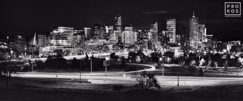 A black and white panoramic cityscape of Denver, Colorado seen at night. Large-scale fine art prints of this photo are available up to 120 inches wide and framed in various styles. 
