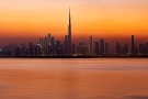 A high-definition skyline of the Burj Khalifa and Dubai Creek at sunset, United Arab Emirates. Large-scale fine art prints of this photo are available up to 120 inches in width and framed in various wood, metal, and acrylic styles. 
