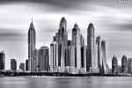 A black and white long-exposure photo of Dubai Marina as seen from Palm Jumeirah captured with an eight minute exposure time, United Arab Emirates. Limited edition fine art prints of this photo are available up to 72 inches in width.