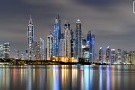 A long-exposure photo of the colorful skyline Dubai Marina at night, United Arab Emirates.