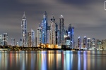 A long-exposure photo of the colorful skyline Dubai Marina at night, United Arab Emirates.