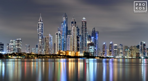 A long-exposure photo of the colorful skyline Dubai Marina at night, United Arab Emirates.