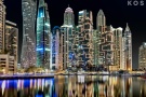 A large format photograph of the view of the tall towers of Dubai Marina at night by photographer Andrew Prokos