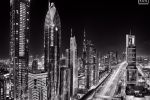 A black and white skyline of the towers along Sheikh Zayed Road, Dubai seen at night, United Arab Emirates. Limited edition fine art prints are available up to 96 inches in width framed in wood, acrylic and metal styles.