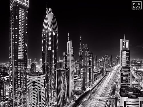A black and white skyline of the towers along Sheikh Zayed Road, Dubai seen at night, United Arab Emirates. Limited edition fine art prints are available up to 96 inches in width framed in wood, acrylic and metal styles.