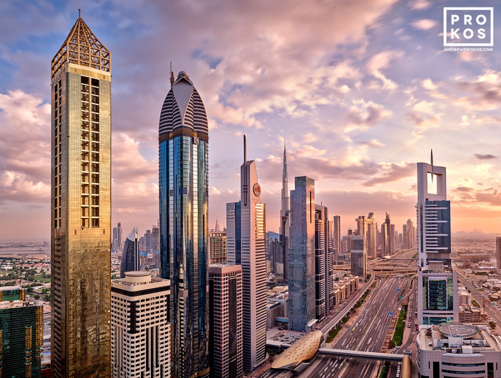 A Dubai skyline photo of the towers along Sheikh Zayed Road at sunset, United Arab Emirates. Composed of multiple high-definition images merged to create large-format fine art prints up to 90 inches in width. Available framed in our wood, metal, and acrylic framing styles.