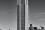 A black and white vertical panoramic view of the Empire State Building and Midtown Manhattan, New York City. High-definition fine art prints of this photo are available up to 90 inches in height and framed in wood, metal, and acrylic styles.