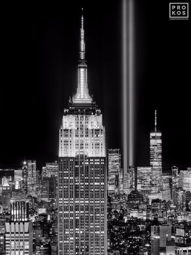 A black and white view of the Empire State Building, World Trade Center and New York City skyline at night captured on the 20th anniversary of September 11th. Large-format limited edition prints of this photo are available up to 80 inches in height and framed in various styles. 