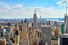 A high-definition panoramic skyline of the skyscrapers of Midtown Manhattan NYC and the Empire State Building as seen from from Rockefeller Center by photographer Andrew Prokos