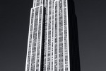 A vertical architectural panorama of the Empire State Building in black and white, New York City