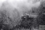 A black and white landscape photo of the Agia Paraskevi monastery in Vikos Gorge, Epirus, Greece