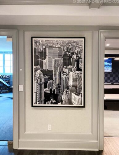 Framed black and white photograph of a view of Midtown Manhattan NYC by photographer Andrew Prokos installed in a luxury home