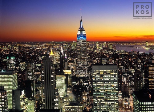 A view of the Empire State Building from Rockefeller Center at dusk.