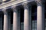 A view of the facade and neoclassical columns of the Farley Building and Moynihan Train Hall in Manhattan, NYC at night by architectural photographer Andrew Prokos. Framed fine art prints of this photo are available in wood, metal and acrylic styles.