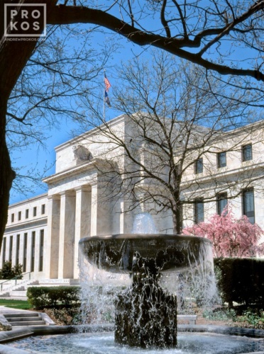 A color photograph of the United States Federal Reserve in Washington DC, with fountain in the foreground. Framed fine art prints of this photo are available up to 40 inches. 