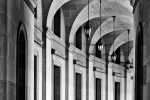 A black and white architectural photo of an archway in Federal Triangle in Washington DC