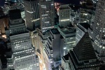 An aerial view of Lower Manhattan, Financial District, the New York Stock Exchange and New York Harbor at night. Framed fine art prints of this photo are available up to 30 inches in height.