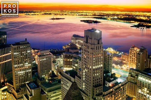 A view of New York City's Financial District and New York Harbor at dusk