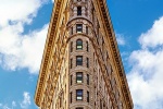 A fine art architectural photo of the Flatiron Building in color, New York, NY